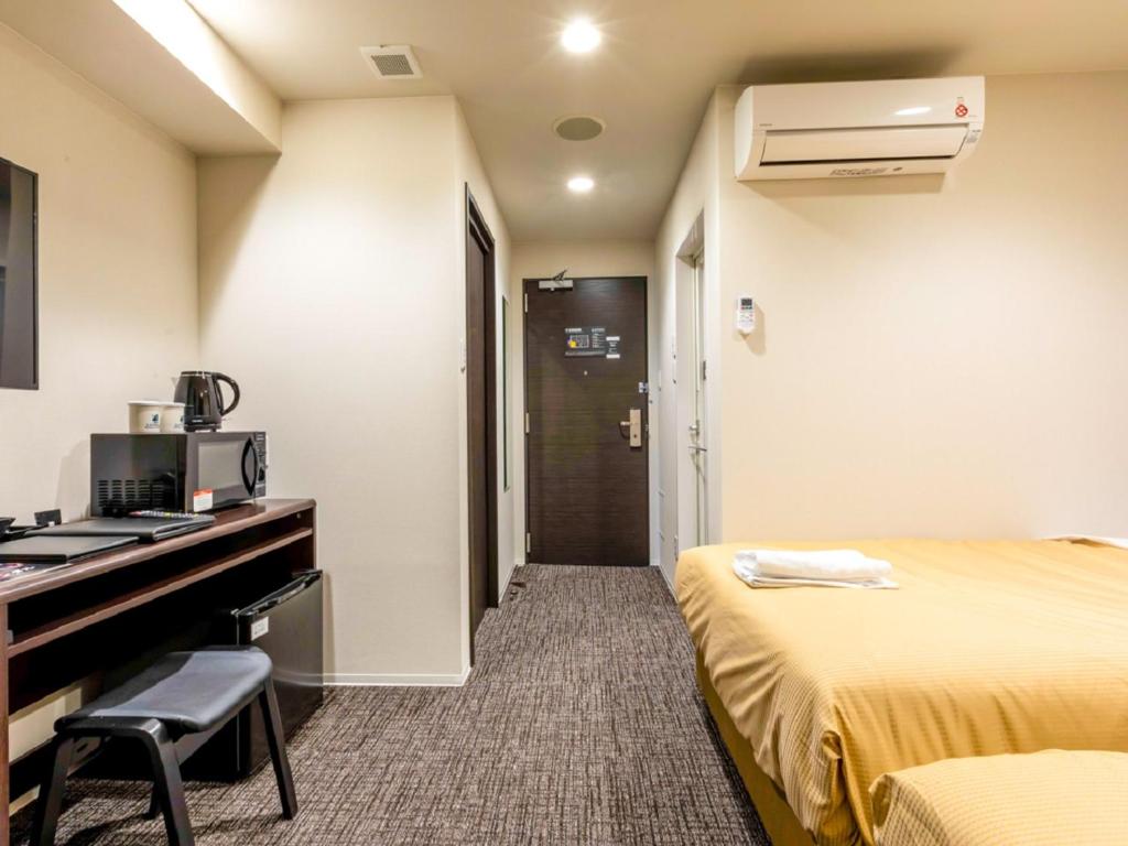 TV a/nebo společenská místnost v ubytování HOTEL LiVEMAX Okazaki