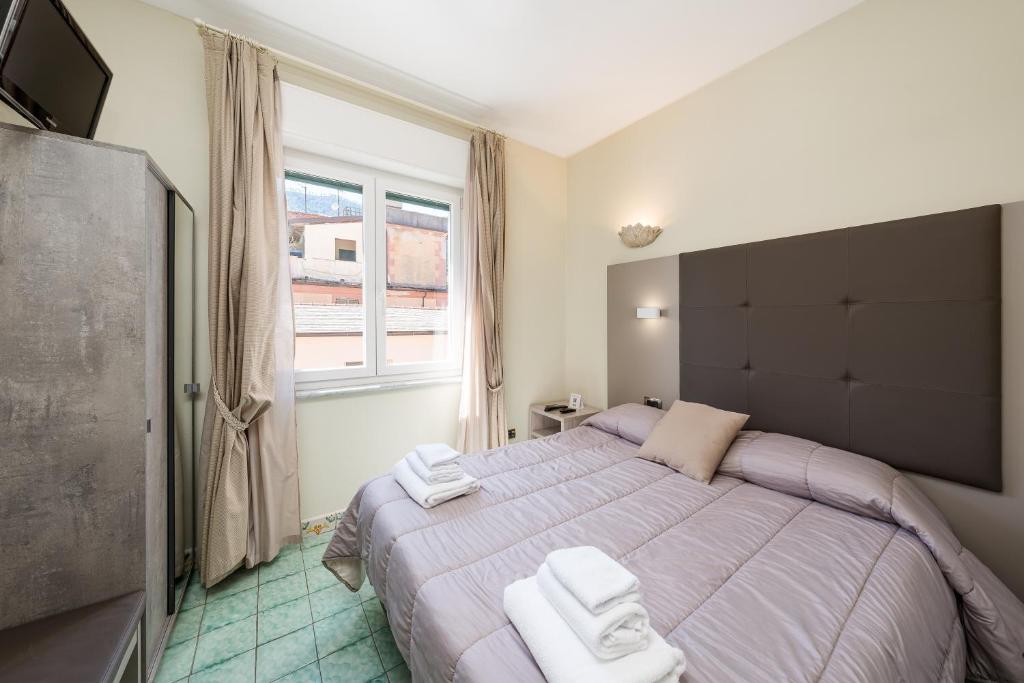 Postel nebo postele na pokoji v ubytování Villa degli Argentieri