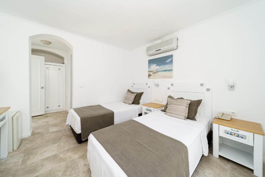 Postel nebo postele na pokoji v ubytování Costa Sariyaz Hotel Bodrum