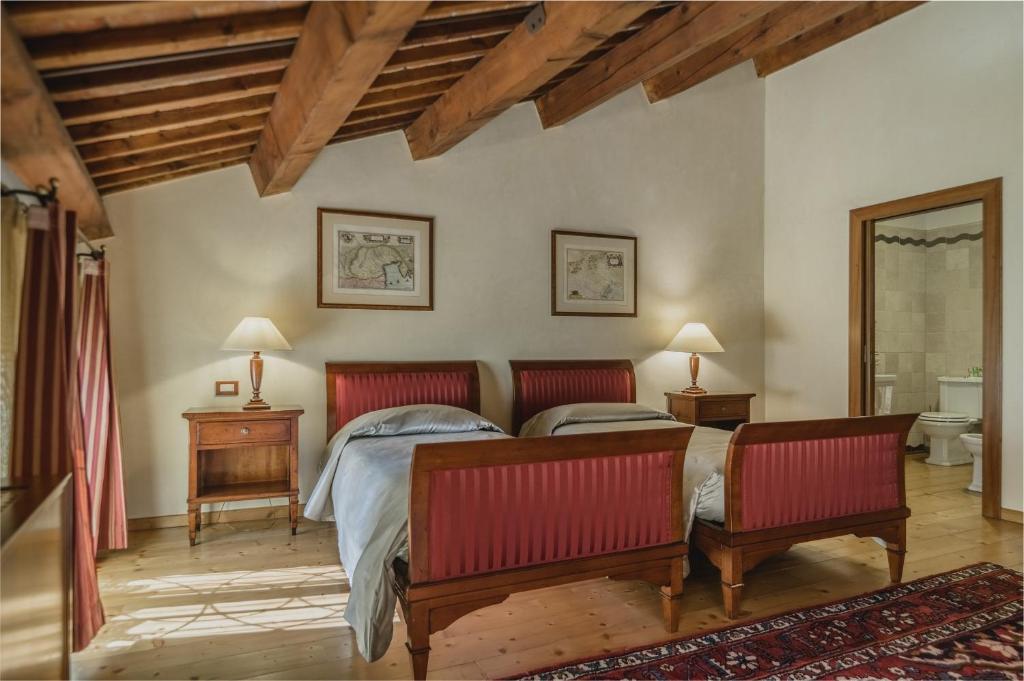A bed or beds in a room at Le Camere di Palazzo Bortolan