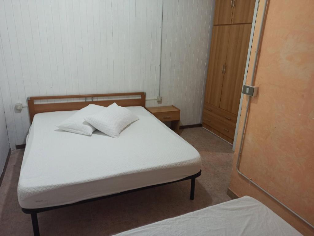 Postel nebo postele na pokoji v ubytování Camping Poseidonia