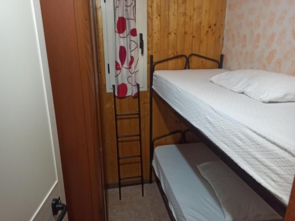Postel nebo postele na pokoji v ubytování Camping Poseidonia