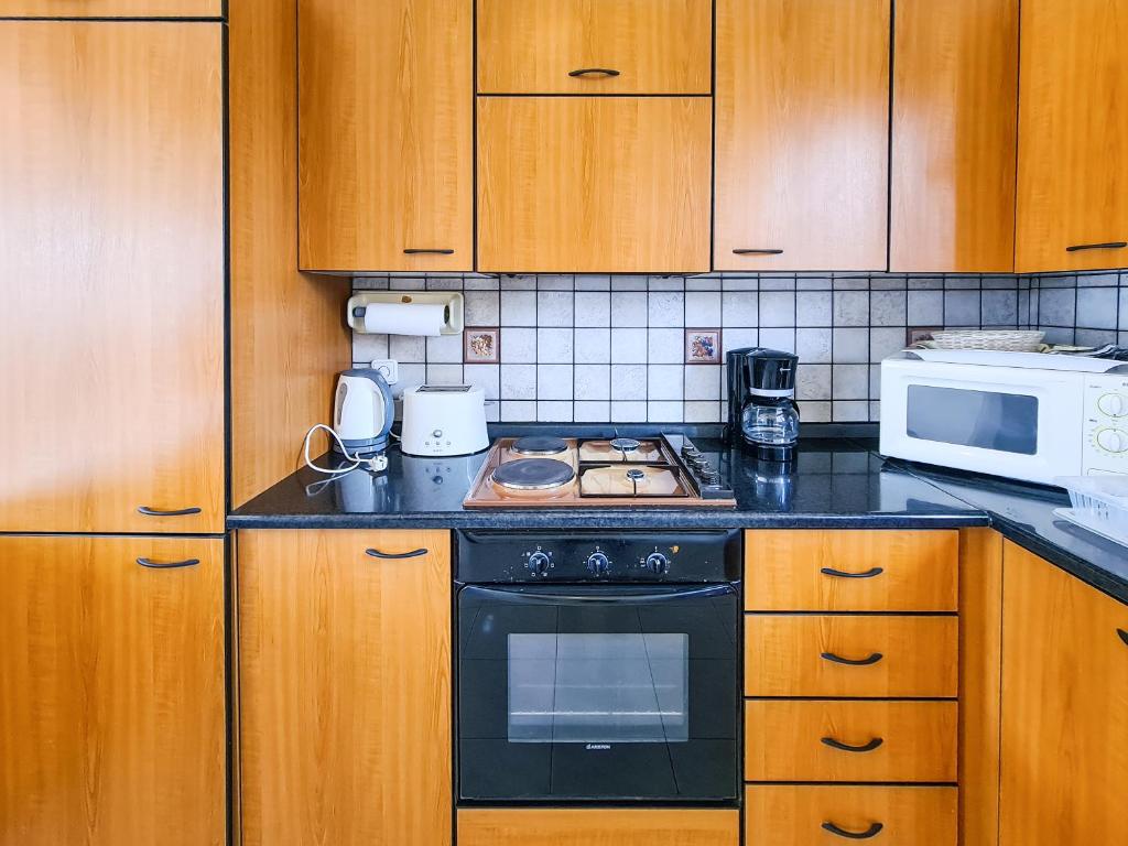 Kuchyňa alebo kuchynka v ubytovaní Colonial Studio/Apartment