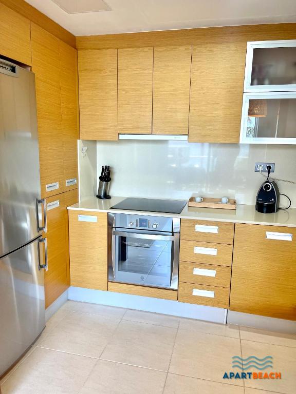 A kitchen or kitchenette at APARTBEACH PANORAMIC VISTAS PLAYA y PISCINA