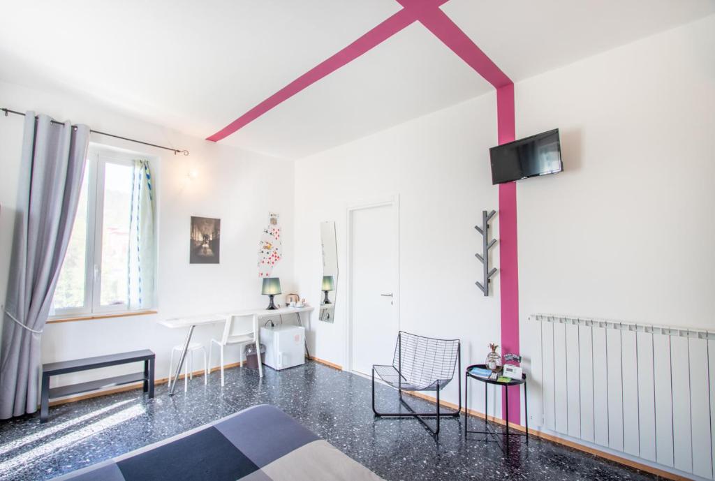 Televízia a/alebo spoločenská miestnosť v ubytovaní MAISON44