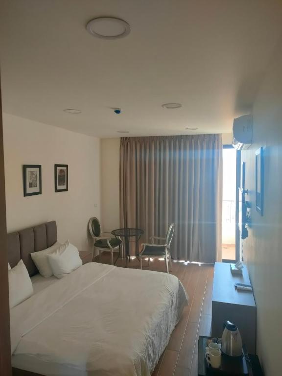 Postel nebo postele na pokoji v ubytování Sindyan Resort