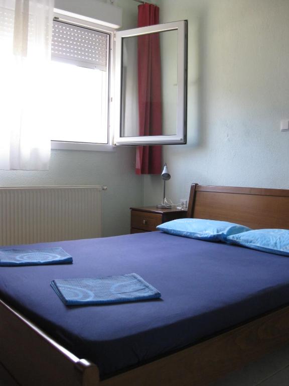 Postel nebo postele na pokoji v ubytování Europa Apartments Stefanos