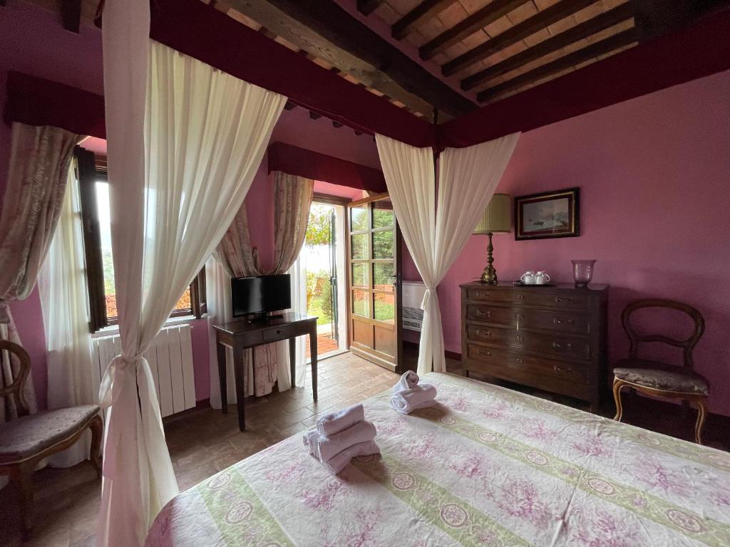 Postel nebo postele na pokoji v ubytování Agriturismo Le Sughere