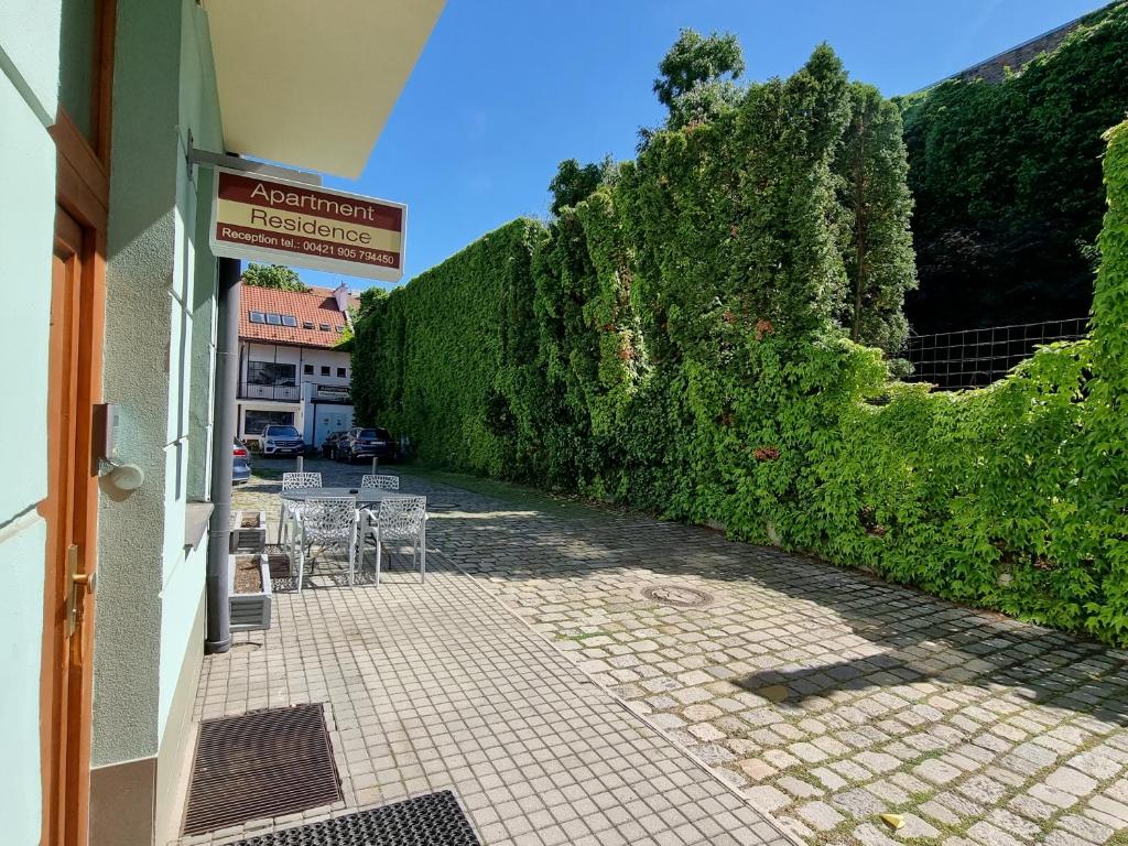 a patio area with benches and a walkway at Apartment Residence - FREE PARKING in Bratislava
