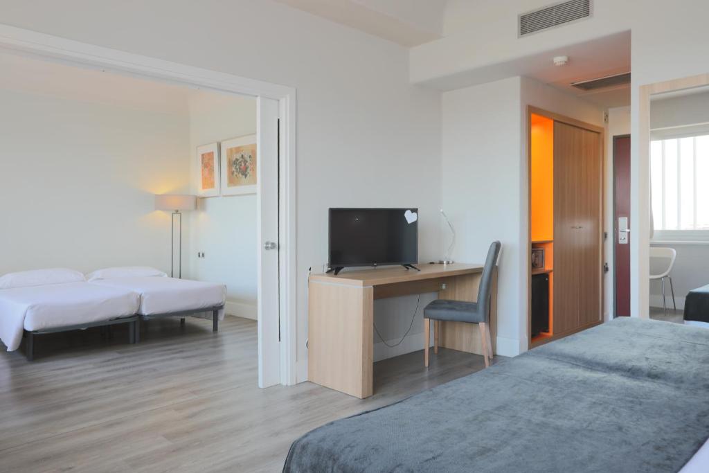Postel nebo postele na pokoji v ubytování Hotel Chamartin The One