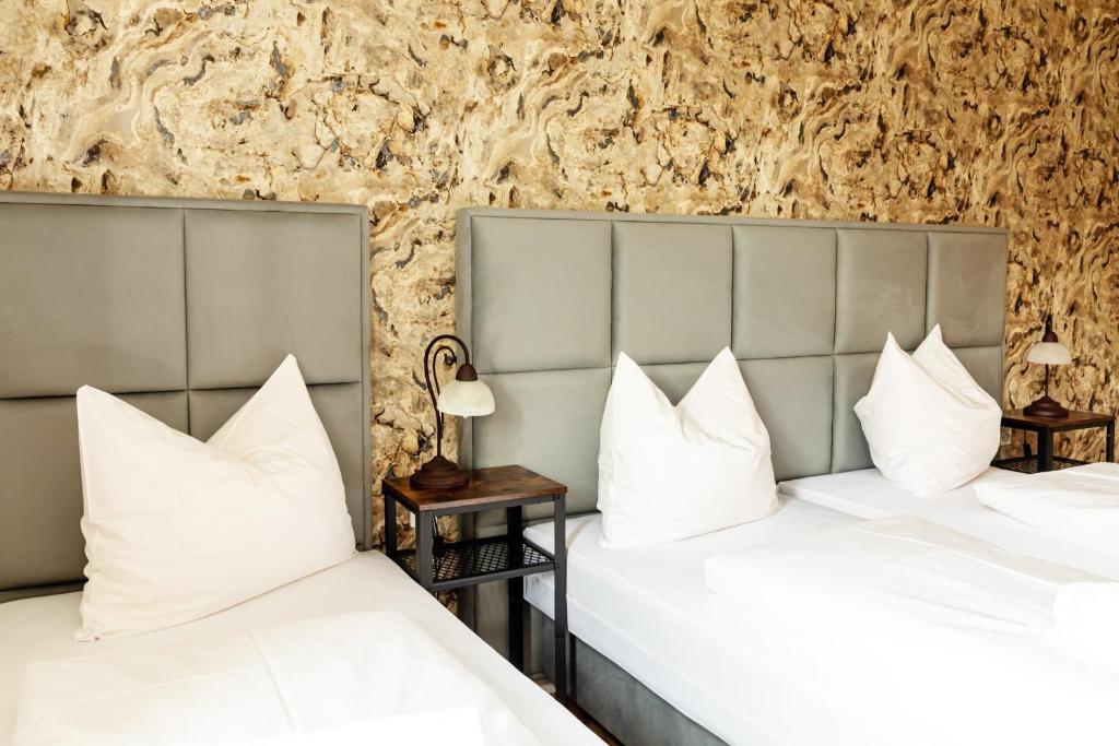 Postel nebo postele na pokoji v ubytování Hotel Kaiserhof