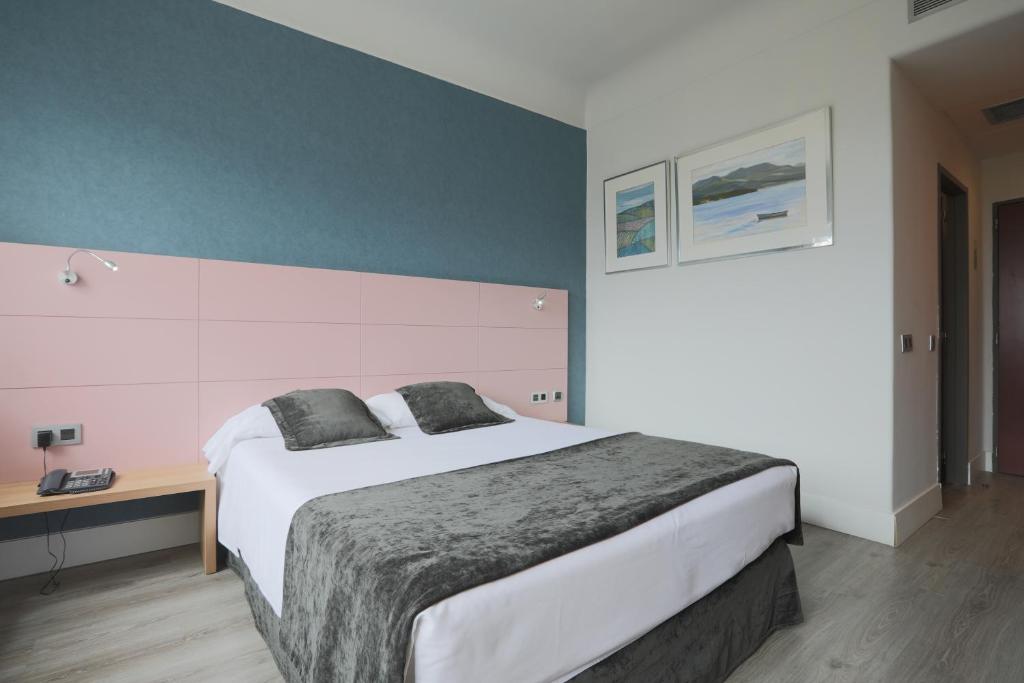 Postel nebo postele na pokoji v ubytování Hotel Chamartin The One