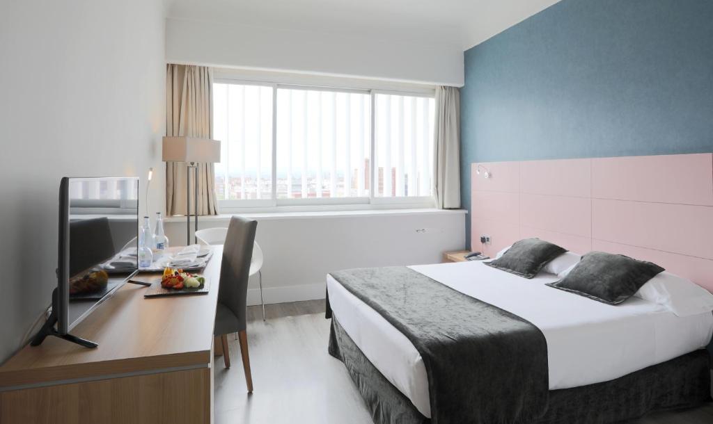 Postel nebo postele na pokoji v ubytování Hotel Chamartin The One