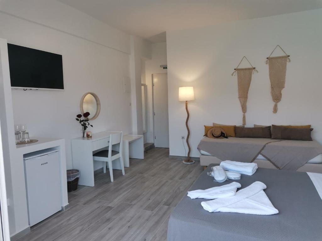 Postel nebo postele na pokoji v ubytování Galazio Rooms & Suites