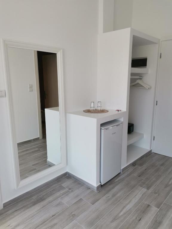 Kuchyň nebo kuchyňský kout v ubytování Galazio Rooms & Suites