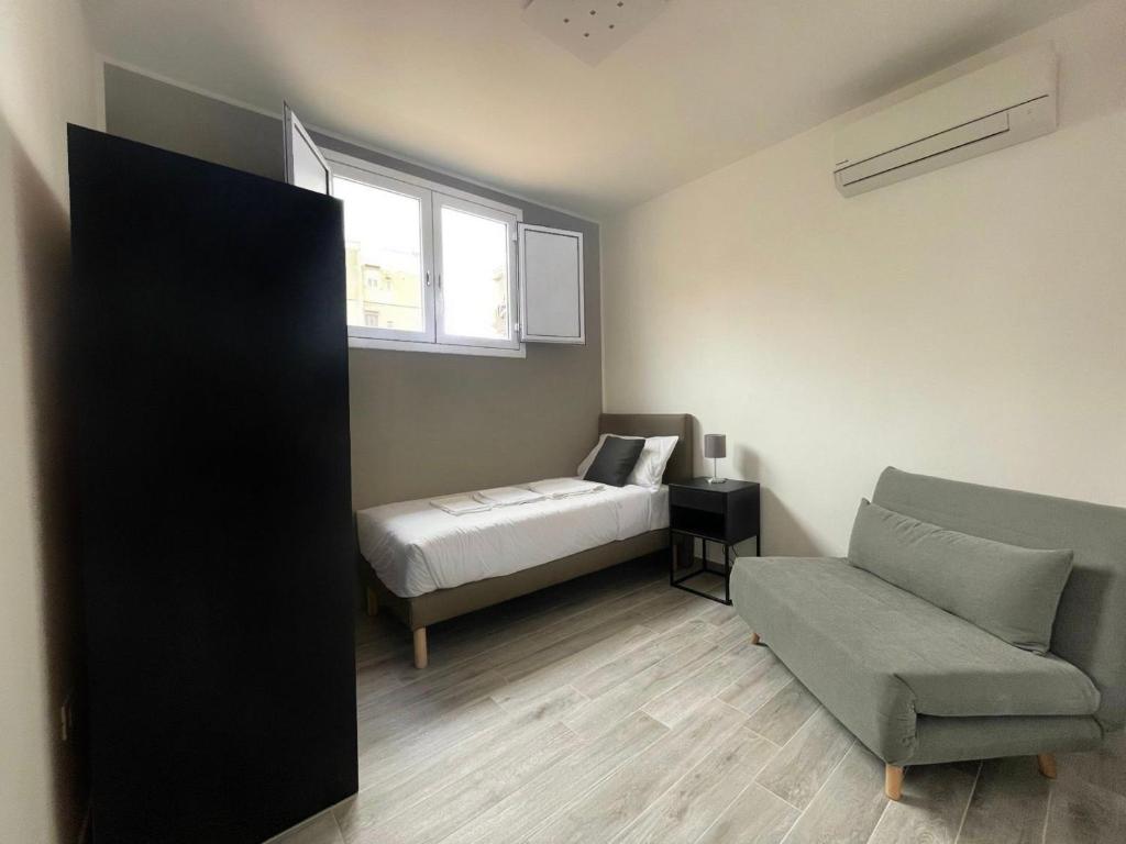 Łóżko lub łóżka w pokoju w obiekcie Le Cinque Stanze Palermo Room&Breakfast