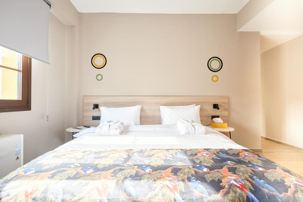 Postel nebo postele na pokoji v ubytování The Mavili urban stay