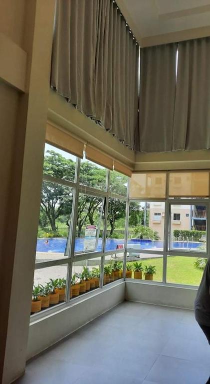 Fotografie z fotogalerie ubytování Amaia Steps Nuvali fully furnished unit with swimming pool view near Carmelray Pitland v destinaci Calamba