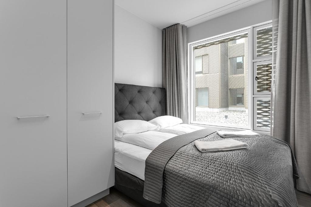 Postel nebo postele na pokoji v ubytování Modern Apt in Central Reykjavík