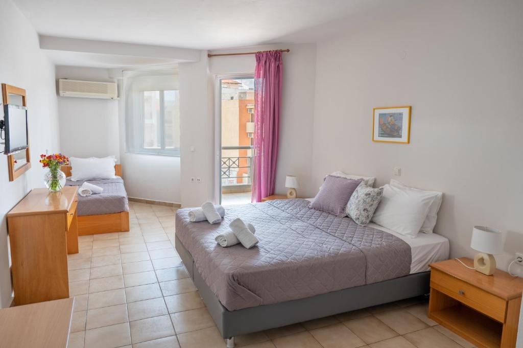 Cama o camas de una habitación en Hotel Arethousa