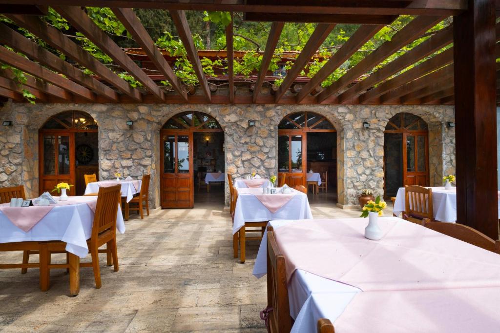 A restaurant or other place to eat at Watermill Villa & Hotel Faralya