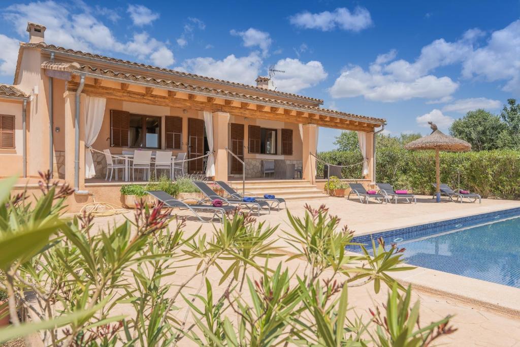 an external view of a house with a swimming pool at Villa Son Sala Nou in Campos