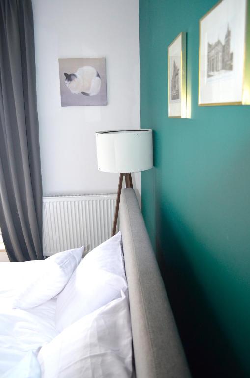 Posteľ alebo postele v izbe v ubytovaní Lighter Apartment