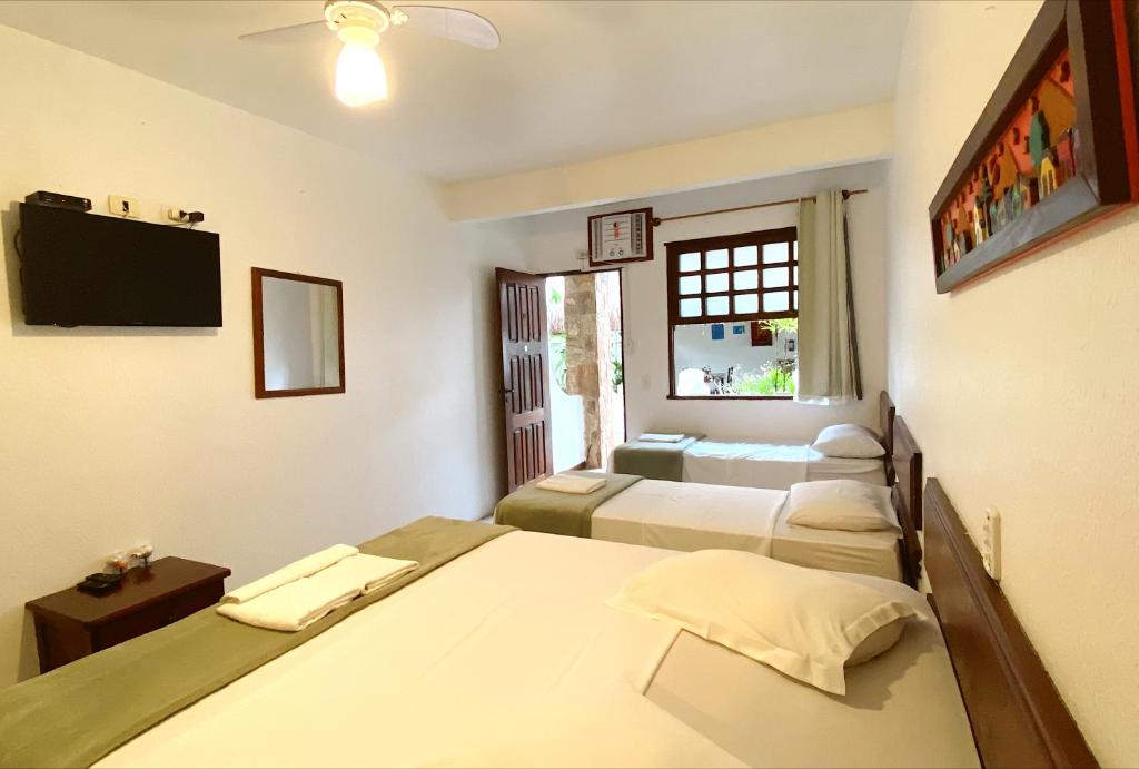 Cama ou camas em um quarto em HOTELARE Hotel Brunello