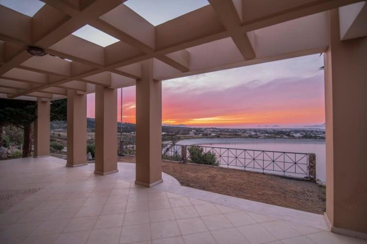 an empty patio with a view of a sunset at KOS UNIQUE in Kos Town