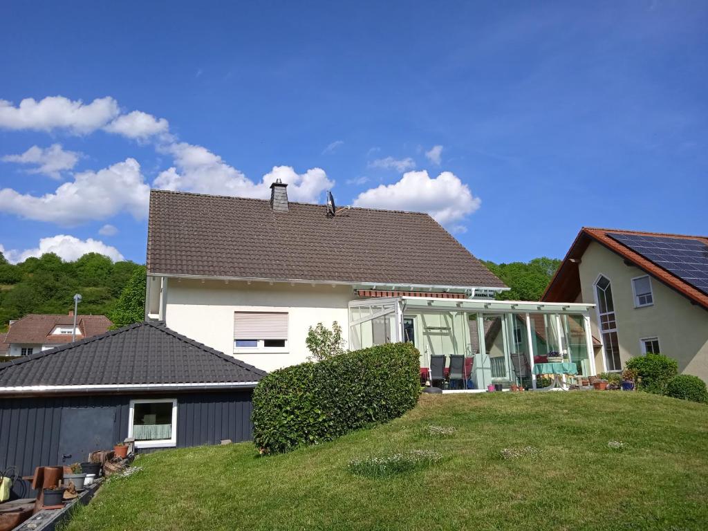 a large white house with a large yard at Ferienwohnung kaub in Immerath