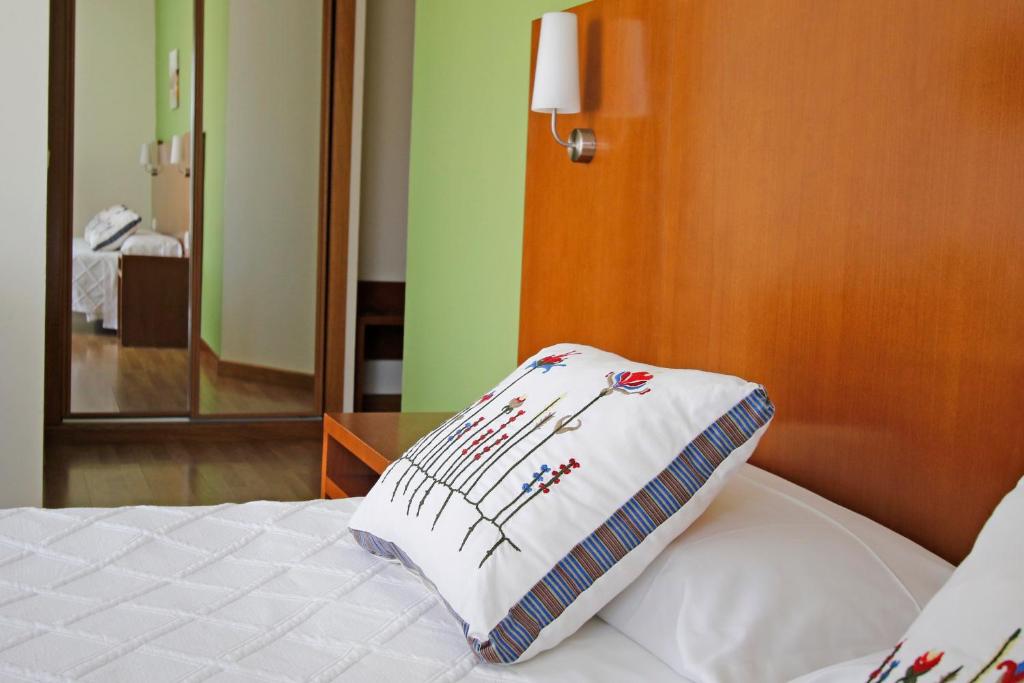 Postel nebo postele na pokoji v ubytování Villa de Colunga