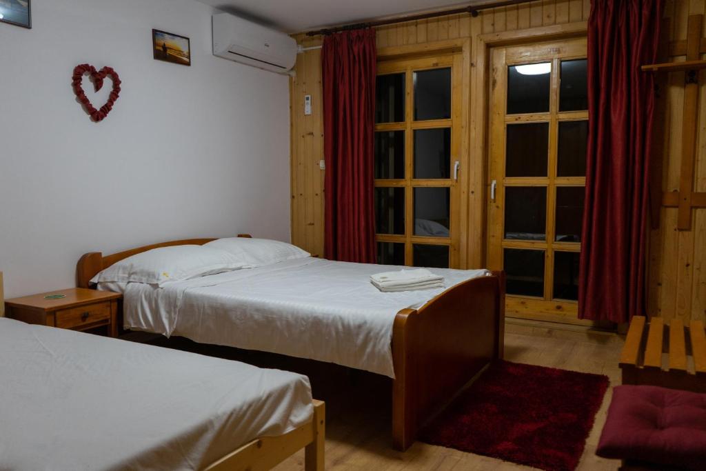 Postel nebo postele na pokoji v ubytování Casa Karol