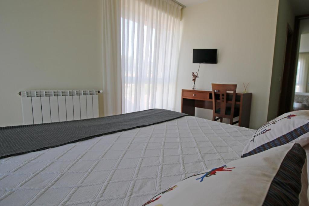 Postel nebo postele na pokoji v ubytování Villa de Colunga