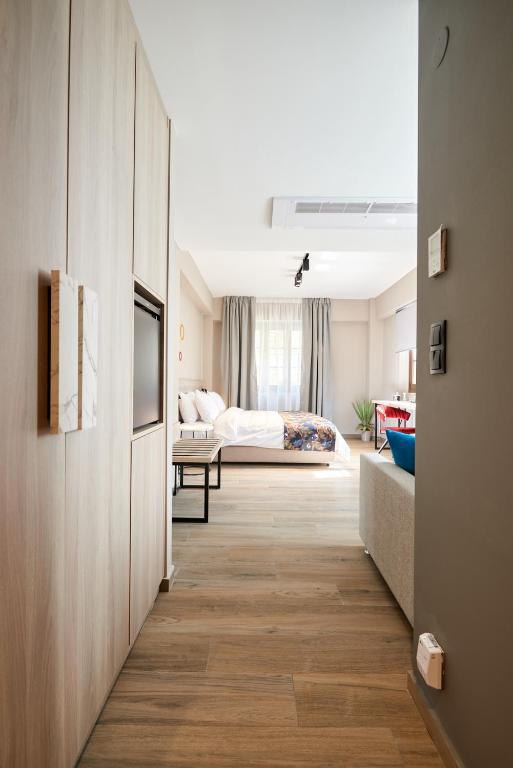 Postel nebo postele na pokoji v ubytování The Mavili urban stay