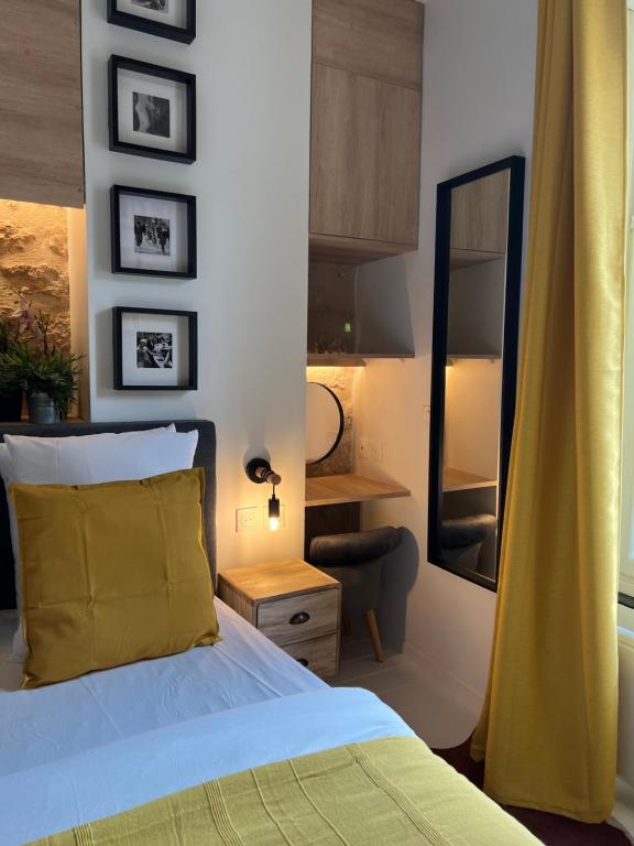 Posteľ alebo postele v izbe v ubytovaní Au Passage des Marais - City Centre