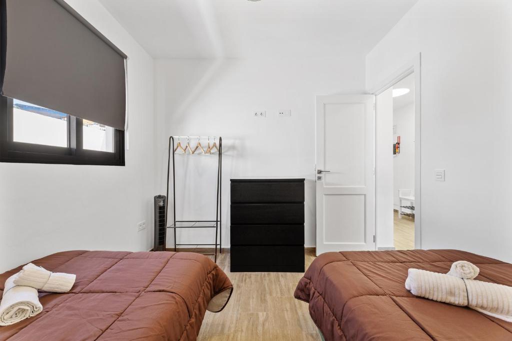 A bed or beds in a room at Holiday in Lanzarote!