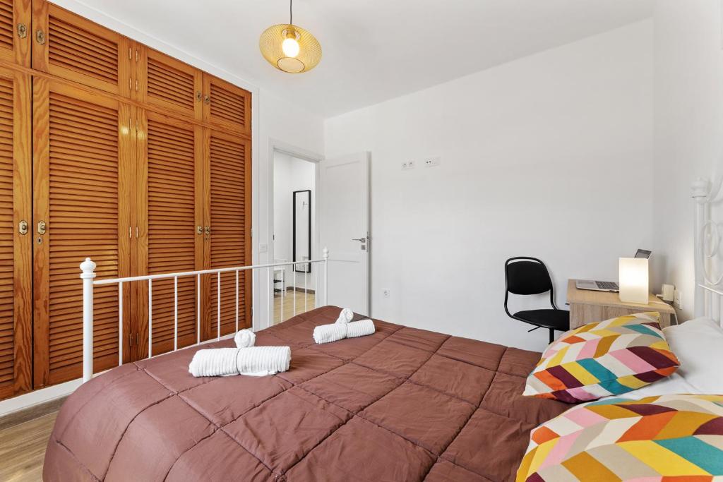 A bed or beds in a room at Holiday in Lanzarote!