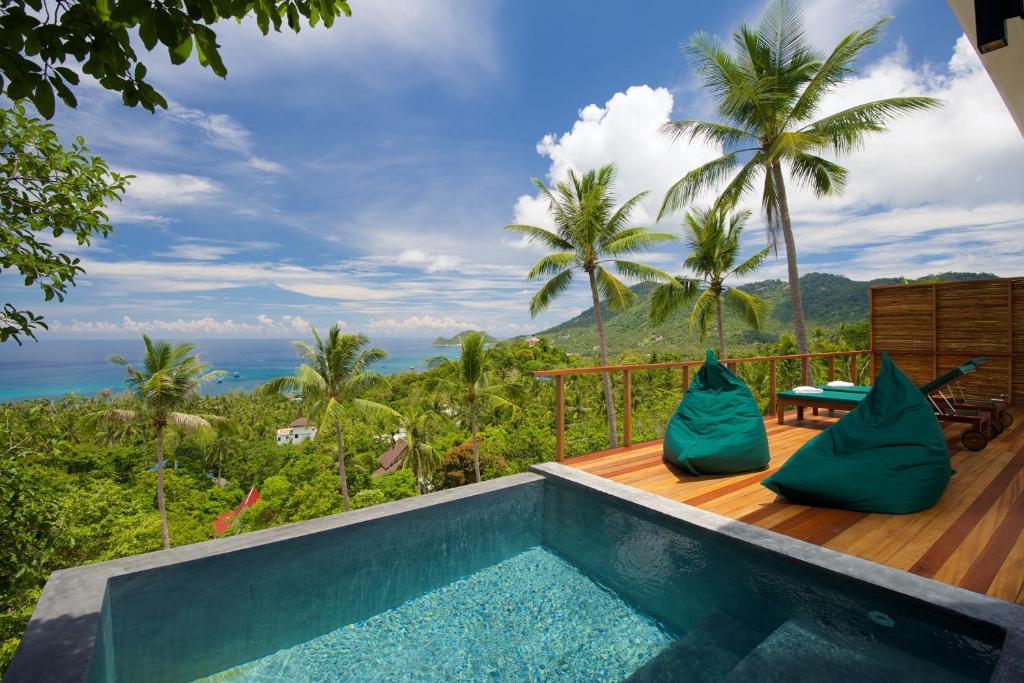 a pool in a villa with a view of the ocean at Overthemoon Luxury Pool Villas in Ko Tao