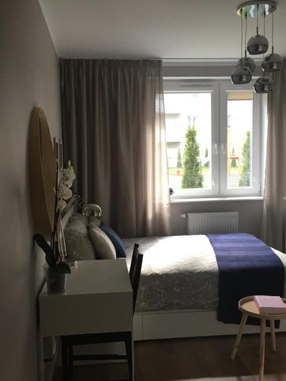 Posteľ alebo postele v izbe v ubytovaní Apartament Przy Obserwatorium&Singielnia