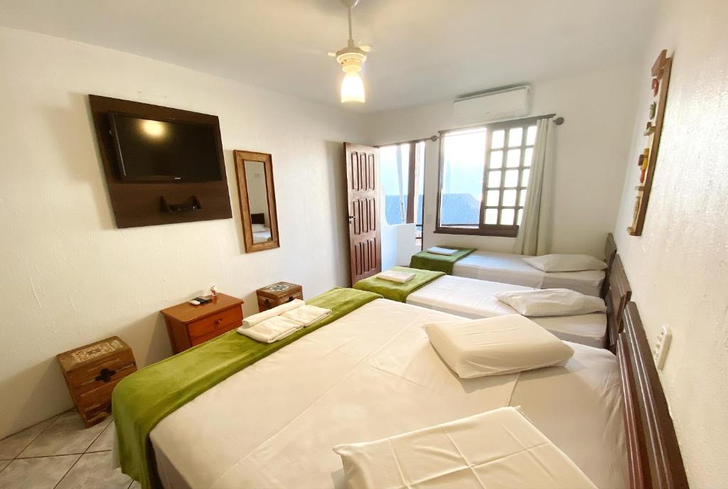 Cama ou camas em um quarto em HOTELARE Hotel Brunello