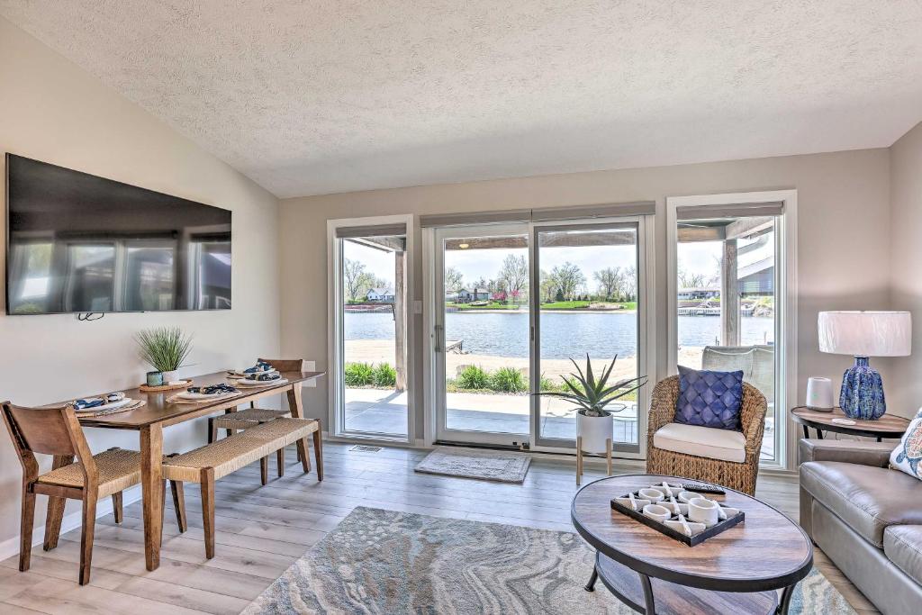 a living room with a couch and a table at Lakefront Bellevue Home Private Beach and Fire Pit! in Bellevue