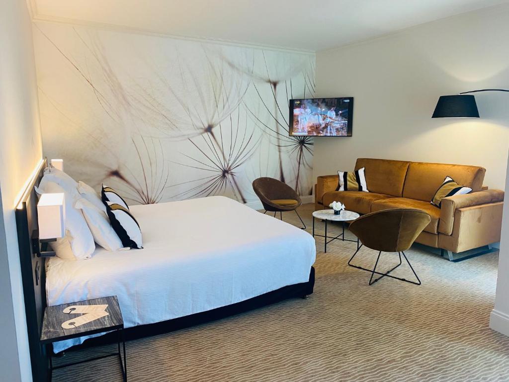Postel nebo postele na pokoji v ubytování Palmyra Golf Hotel & Spa