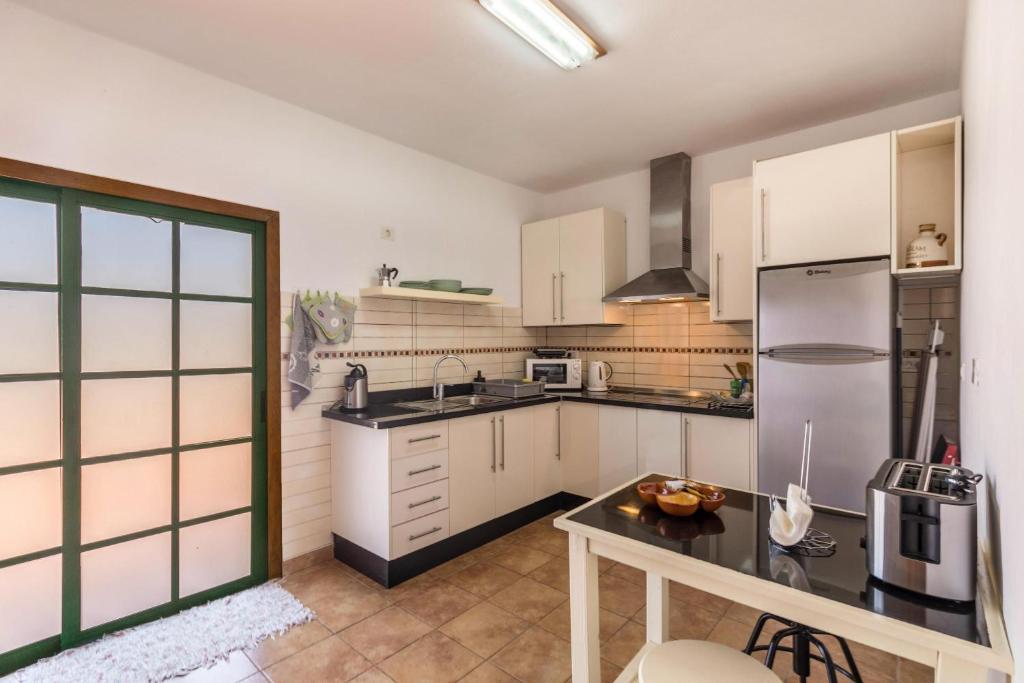 Kuchyň nebo kuchyňský kout v ubytování Apartamento B Armonia Rural
