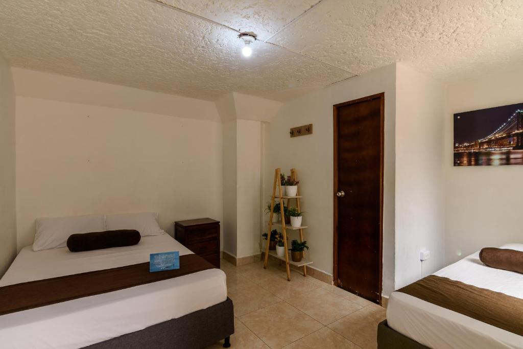 Postel nebo postele na pokoji v ubytování Hotel Sol del Estadio
