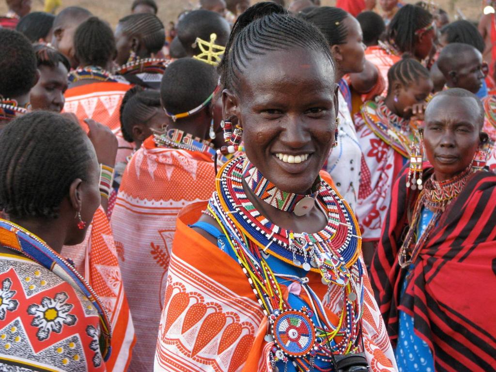 a group of people standing in a crowd at Maasai Simba Camp in Amboseli