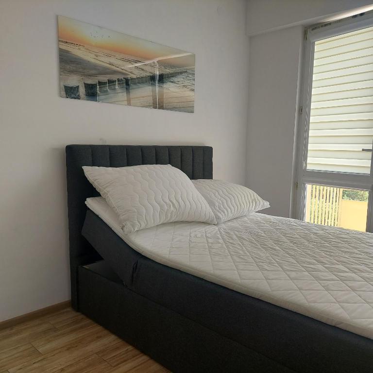 Posteľ alebo postele v izbe v ubytovaní Apartament MIRA