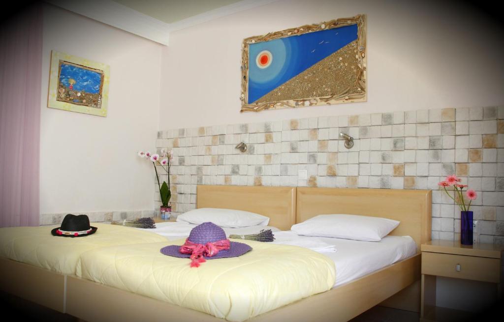 Postel nebo postele na pokoji v ubytování Hotel Kostis