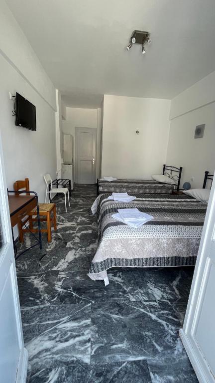 Voodi või voodid majutusasutuse Meropi Rooms toas