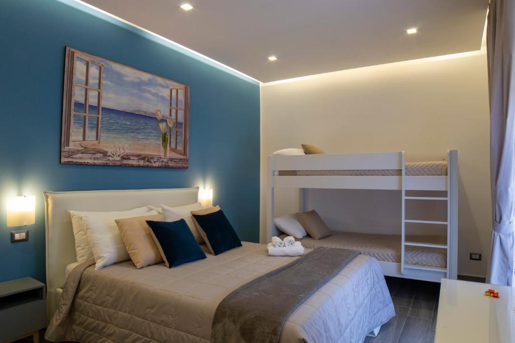 Posteľ alebo postele v izbe v ubytovaní B&B Maremy... I 4 Elementi