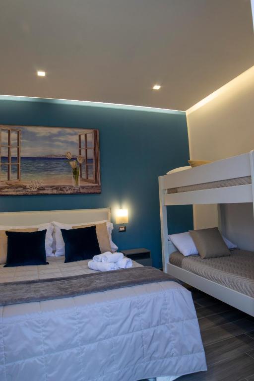 Posteľ alebo postele v izbe v ubytovaní B&B Maremy... I 4 Elementi